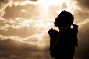 woman prays for adoption